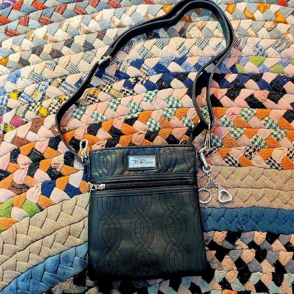 Bella Russo black quilted crossbody bag with adjustable strap and silver hearts